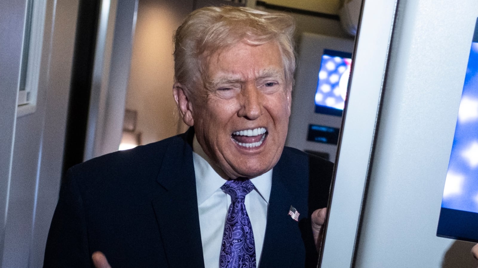 President Donald Trump speaks to the press aboard Air Force One en-route to Washington, DC on November 30, 2025.