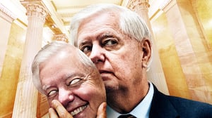 Lindsey Graham removing his mask.