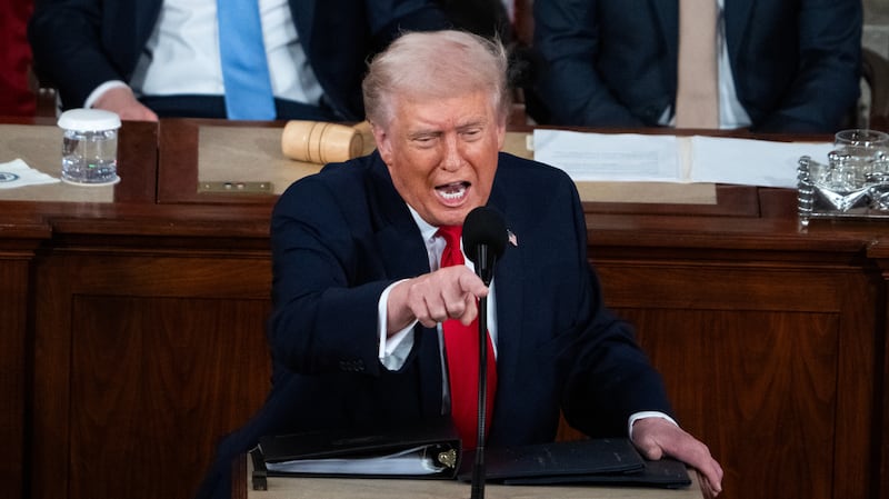 President Donald Trump delivers his State of the Union address in the House Chamber of the U.S. Capitol on Tuesday, February 24, 2026. Vice President JD Vance, left, and Speaker of the House Mike Johnson, R-La., also appear.