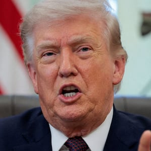 FILE PHOTO: U.S. President Donald Trump speaks during the signing ceremony for an executive order on mail ballots, in the Oval Office of the White House in Washington, D.C., March 31, 2026.  REUTERS/Evan Vucci/File Photo