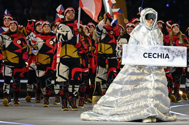 Czech Republic's flag bearer David Pastrnak (C) and fellow Czech Republic's athletes parade during the opening ceremony of the Milano Cortina 2026 Winter Olympic Games at the San Siro stadium in Milan, northern Italy, on February 6, 2026. (Photo by WANG Zhao / AFP via Getty Images)