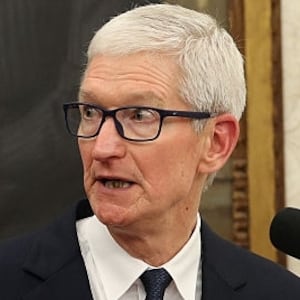 WASHINGTON, DC - AUGUST 06: Apple CEO Tim Cook (R) speaks as U.S. President Donald Trump looks on during an event in the Oval Office of the White House on August 6, 2025 in Washington, DC. Apple Inc. announced a $100 billion investment in manufacturing facilities in the U.S., on top of an announcement in February committing over the next four years to a $500 billion investment in the U.S. economy and the addition of 20,000 new jobs. (Photo by Win McNamee/Getty Images)