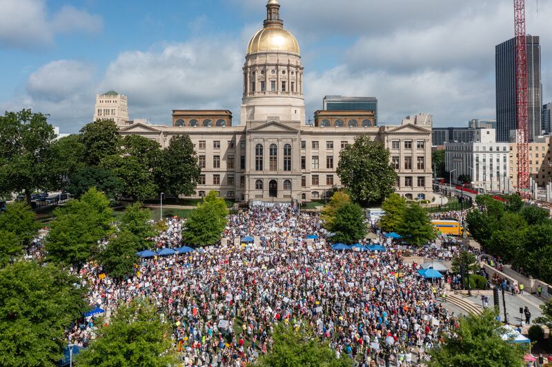People take part in the "No Kings" protest at Liberty Plaza in Atlanta, Georgia, on Saturday.