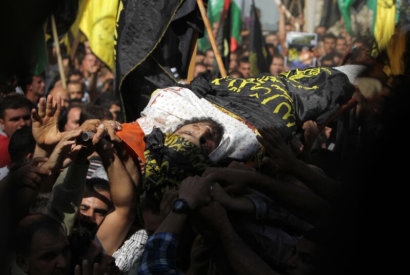 articles/2013/10/30/at-west-bank-funeral-palestinians-express-rising-support-for-armed-resistance/mohammed-assi-openz_nh36el