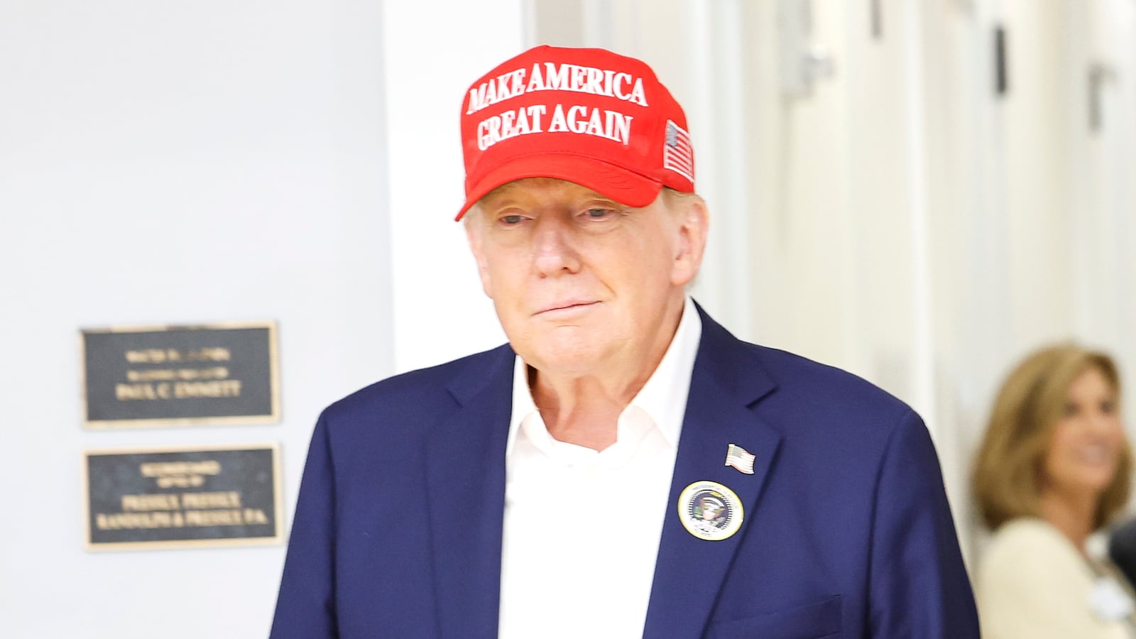 Donald Trump and Melania Trump depart after casting their votes at a polling place in the Morton and Barbara Mandel Recreation Center on Election Day, on November 5, 2024, in Palm Beach, Florida.