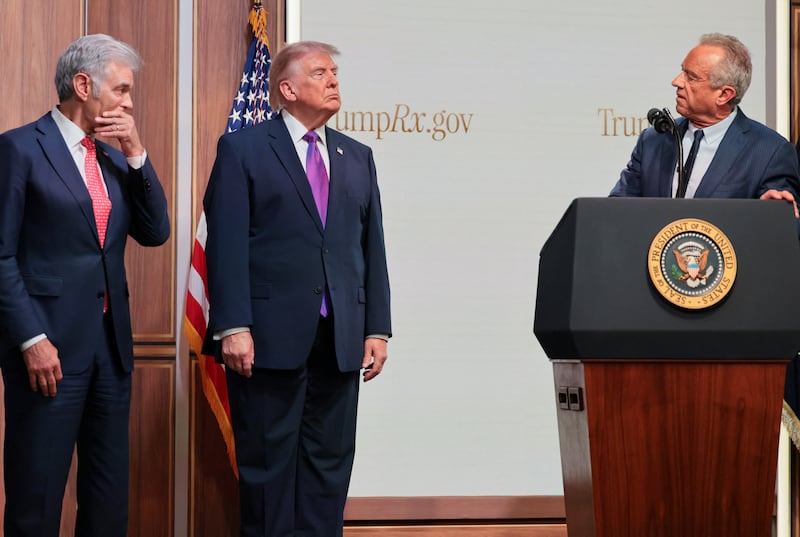 Trump and Oz look on during Kennedy's comments at the TrumpRX news conference.