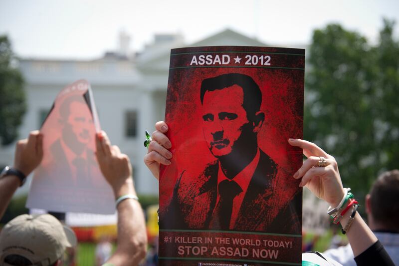 galleries/2013/09/02/president-obama-s-syria-decision-making-photos/130901-wh-assad-sign_r1agod
