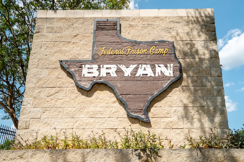 Signage is displayed near the entrance to Federal Prison Camp Bryan on August 01, 2025 in Bryan, Texas.