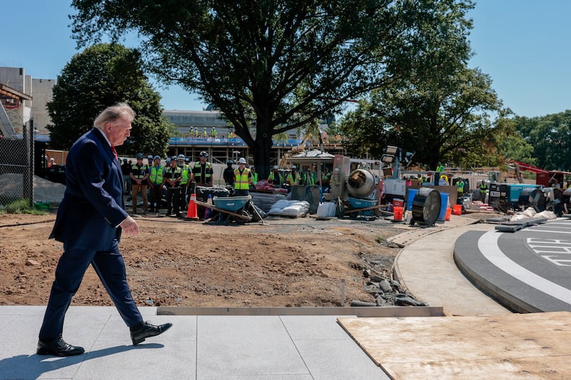 U.S. President Donald Trump walks on the site of the helipad being constructed on the South Lawn, at the White House in Washington, D.C., U.S., August 19, 2026. REUTERS/Kylie Cooper