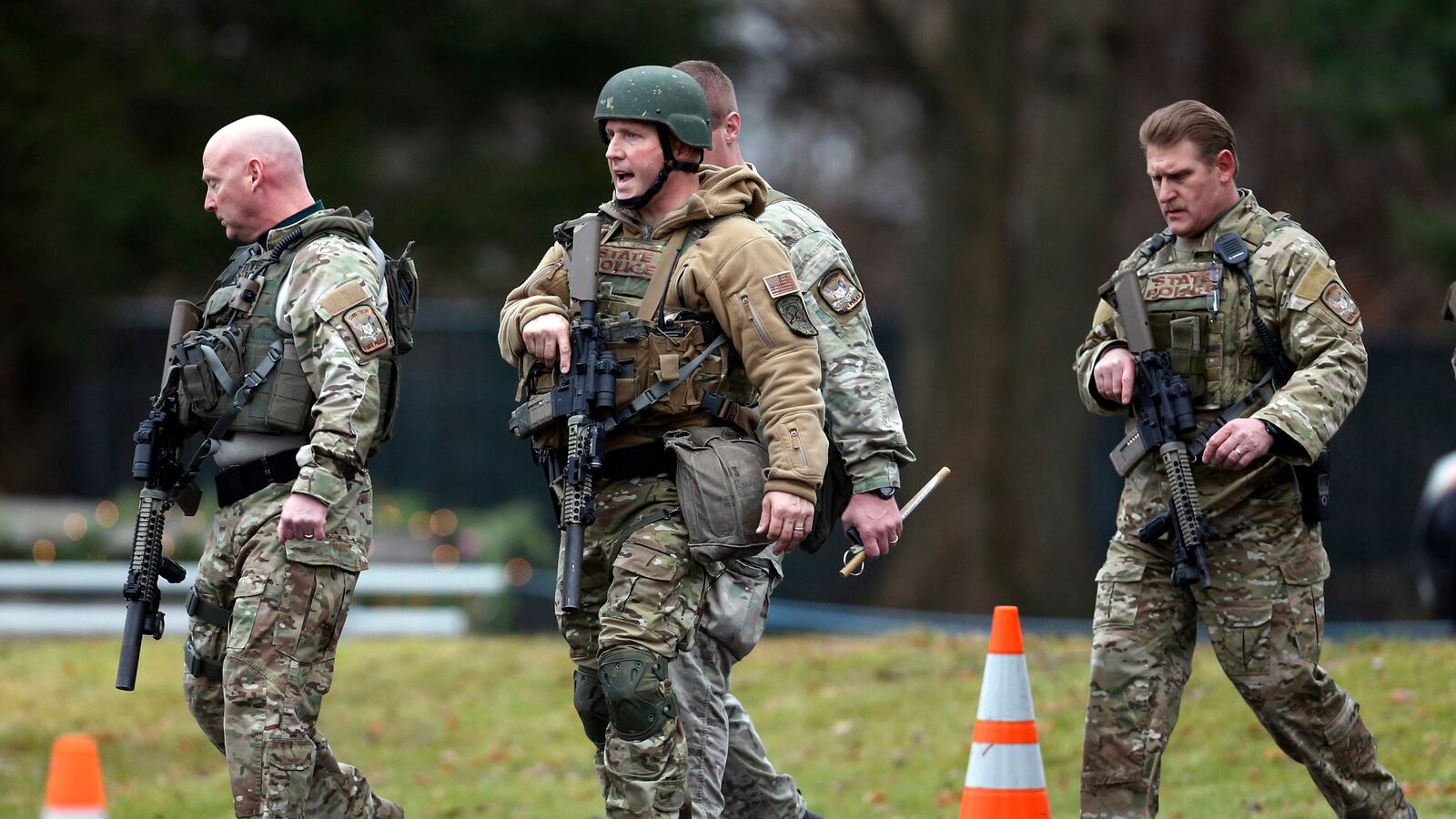 articles/2012/12/17/newtown-conn-struggles-with-its-newfound-notoriety/police-investigation-pelisek-tease_njjxy3