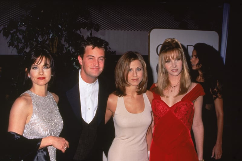 The cast appears at the Golden Globe Awards in January 1996. Photo by William Holz/Fotos International/Getty Images.