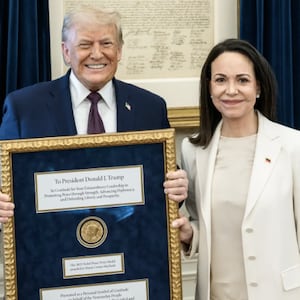 Venezuelan opposition leader Maria Corina Machado presents Donald Trump with her Nobel Peace Prize.