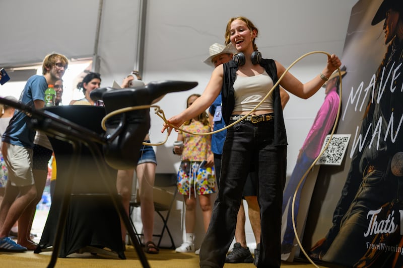 WASHINGTON, DC - JULY 03: A girl tries to lasso a fake bull at the Wyoming tent at the The Great American State Fair after it was reopened following an earlier closure due to extreme temperatures on July 03, 2026 in Washington, DC. The Freedom 250-backed Great American State Fair celebrating the 250th anniversary of the United States closed from around 1PM until 5PM due to high temperatures. The fair runs through July 10th. (Photo by Alexi J. Rosenfeld/Getty Images)