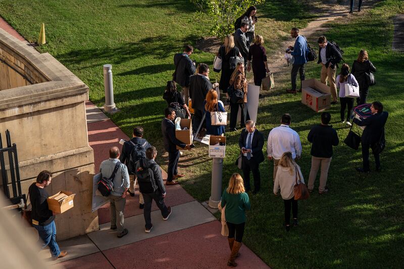 Reporters walk out together after turning in their credentials for refusing to sign new reporting limits dictated by Secretary of Defense Pete Hegseth