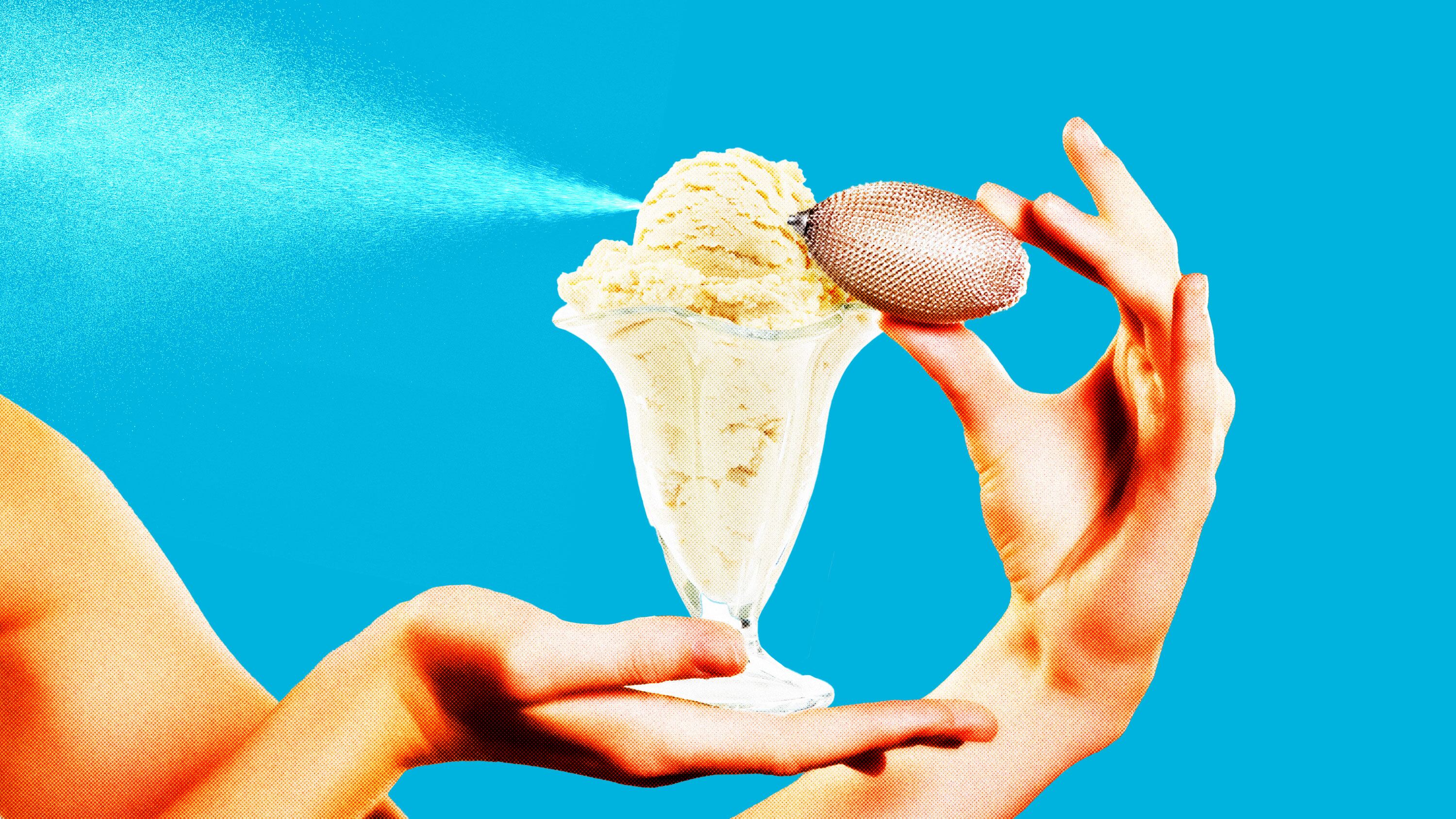Person holding a vanilla ice cream glass with a perfume spray bottle nozzle attached