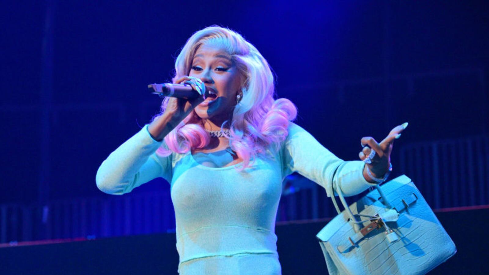 A picture of Cardi B, who chucked a microphone into her crowd mid-concert after a fan splashed her with their drink. The mic sold on eBay for nearly $100,000.
