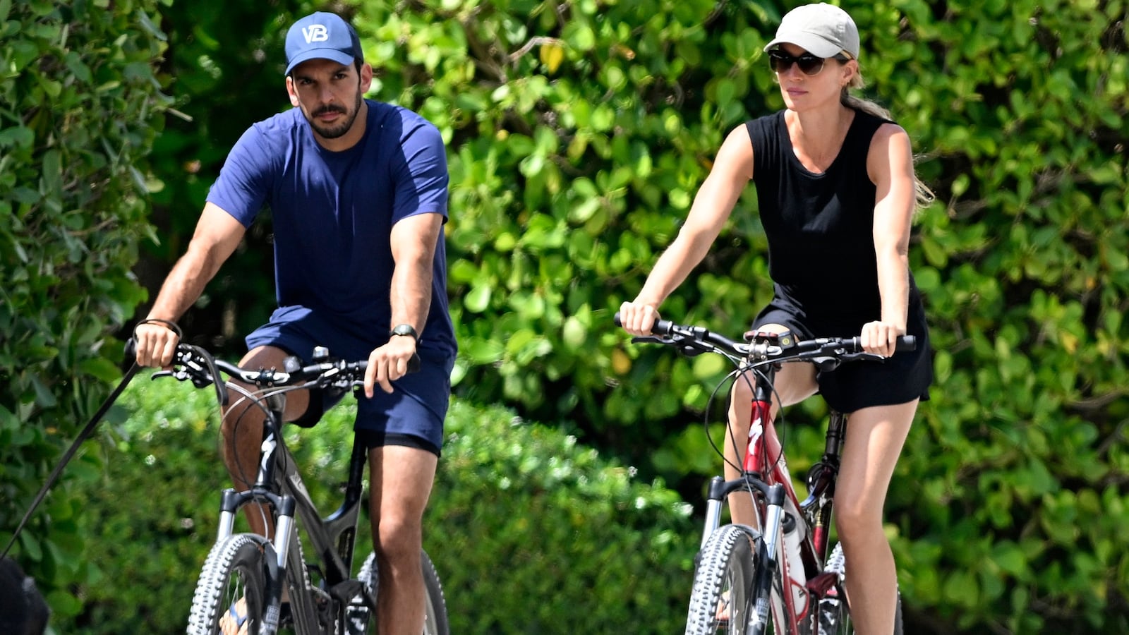 SURFSIDE, FL - JULY 14: Joaquim Valente and Gisele Bündchen are seen on a bike ride on July 14, 2024 in Surfside, Florida. (Photo by MEGA/GC Images)
