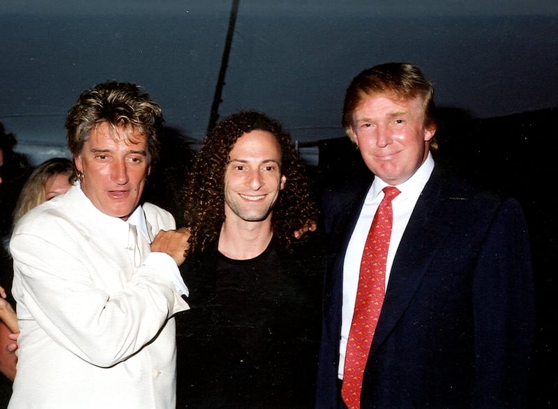 Group portrait of, from left, British musician Rod Stewart, American musician Kenny G (born Kenneth Gorelick), and businessman Donald Trump as they pose together at the Mar-a-Lago estate, Palm Beach, Florida, 1998.