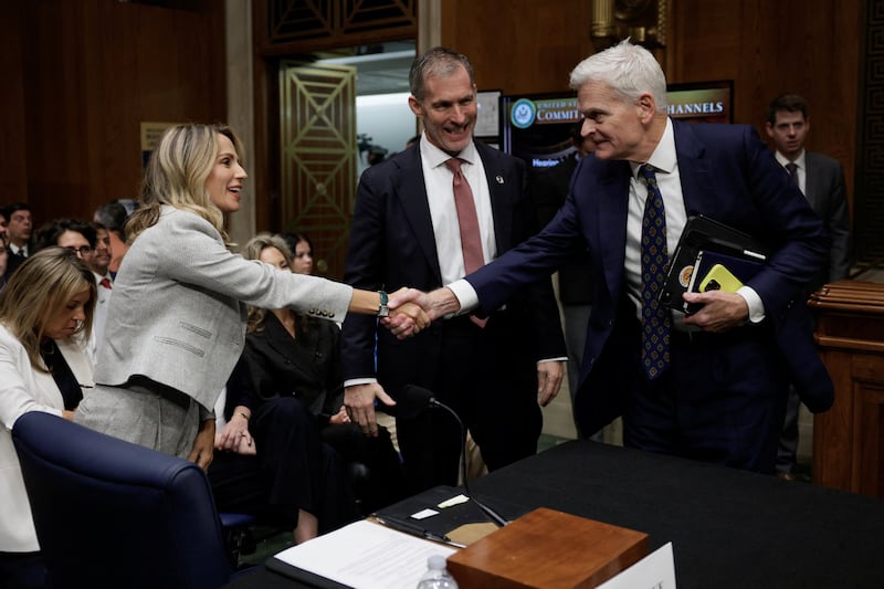 Saphier shakes hands with Sen. Bill Cassidy, chairman of the Senate Health, Education, Labor and Pensions Committee.