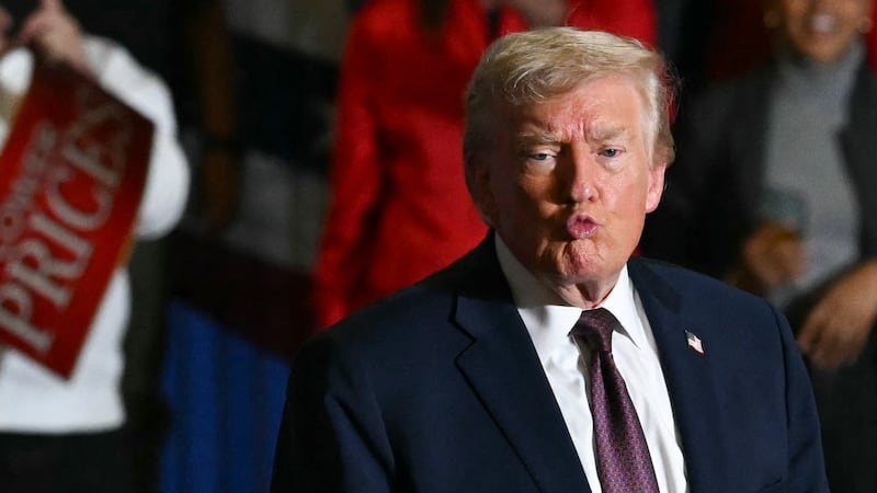 US President Donald Trump gestures to the crowd after speaking at a political rally in Rocky Mount, North Carolina on December 19, 2025. (Photo by ANDREW CABALLERO-REYNOLDS / AFP via Getty Images)