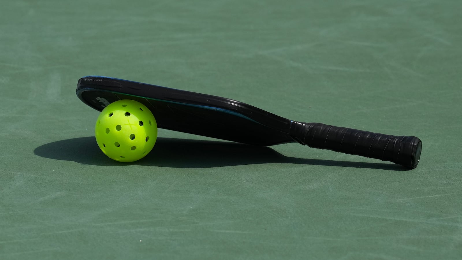 MIDLAND, MICHIGAN - AUGUST 16: A detailed view of a pickleball paddle and ball during the third day of the APP Great Lakes Open at Greater Midland Tennis Center on August 16, 2025 in Midland, Michigan. (Photo by Nic Antaya/The APP/Getty Images)