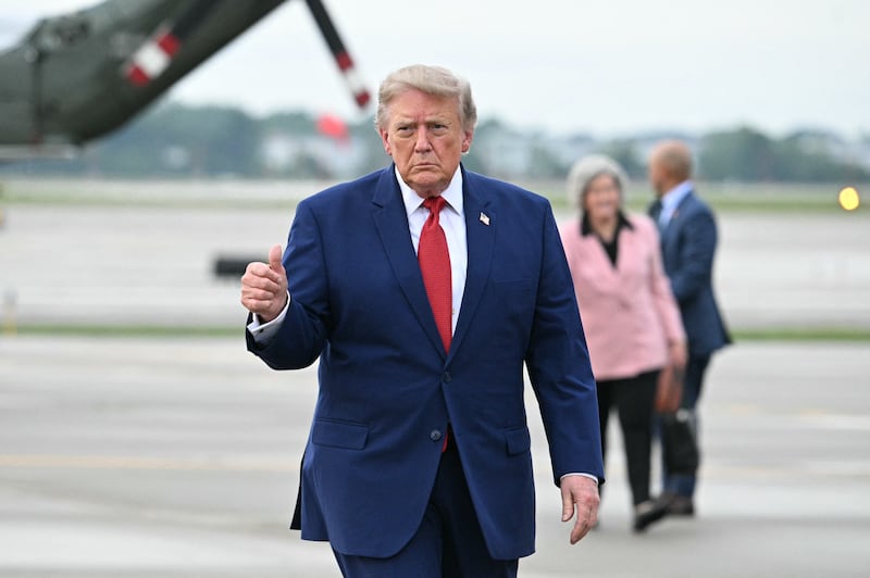 US President Donald Trump gives a thumbs up before boarding Air Force One en route back to Washington, DC, at Cleveland Hopkins International Airport in Cleveland, Ohio on August 11, 2026.