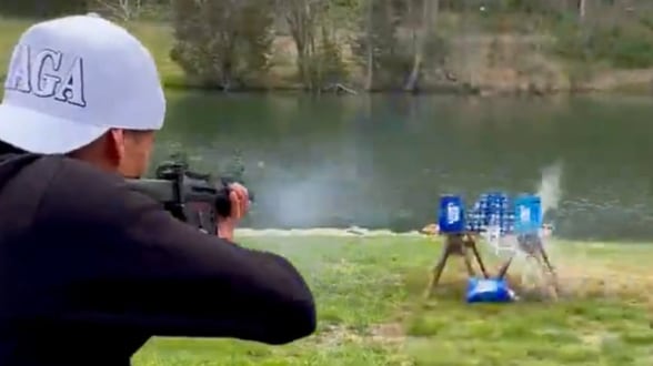 Kid Rock shoots up a case of Bud Light beer.