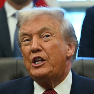 US President Donald Trump makes an announcement from the Oval Office of the White House in Washington, DC on December 3, 2025. President Trump announced weaker fuel efficiency standards for the country, as part of his agenda to lower the price of gasoline-powered cars. (Photo by ANDREW CABALLERO-REYNOLDS / AFP via Getty Images)