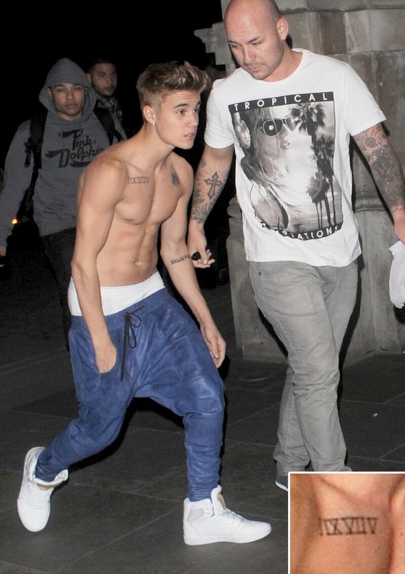 galleries/2013/05/02/justin-bieber-s-tattoos-a-selena-gomez-look-a-like-a-crown-jesus-ink-and-more/130429-justin-bieber-tattoos2_stceoe