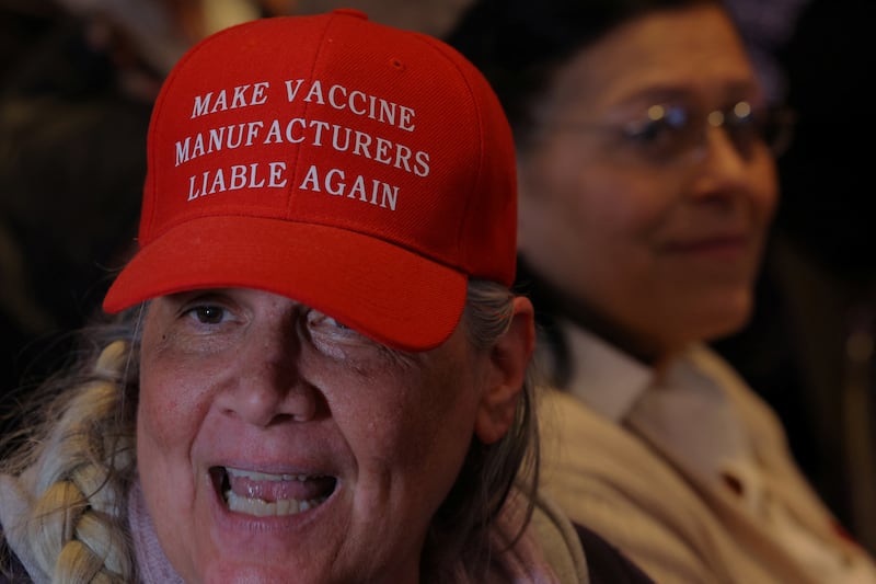 Jean Tobin wears a hat reading "Make Vaccine Manufacturers Liable Again" before a speech by Robert F. Kennedy Jr. announcing his candidacy for the Democratic presidential nomination, in Boston, Massachusetts, U.S., April 19, 2023.
