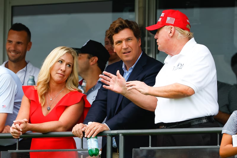 BEDMINSTER, NJ - JULY 31: Former President Donald Trump, Tucker Carlson and Marjorie Taylor Greene during the 3rd round of the LIV Golf Invitational Series Bedminster on July 31, 2022 at Trump National Golf Club in Bedminster, New Jersey. (Photo by Rich Graessle/Icon Sportswire via Getty Images)