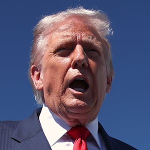 WEST PALM BEACH, FLORIDA - OCTOBER 31: US President Donald Trump speaks to reporters as he arrives at Palm Beach International Airport on October 31, 2025 in West Palm Beach, Florida. Trump is spending the weekend at his Mar-A-Lago estate in Palm Beach, Florida. (Photo by Samuel Corum/Getty Images)