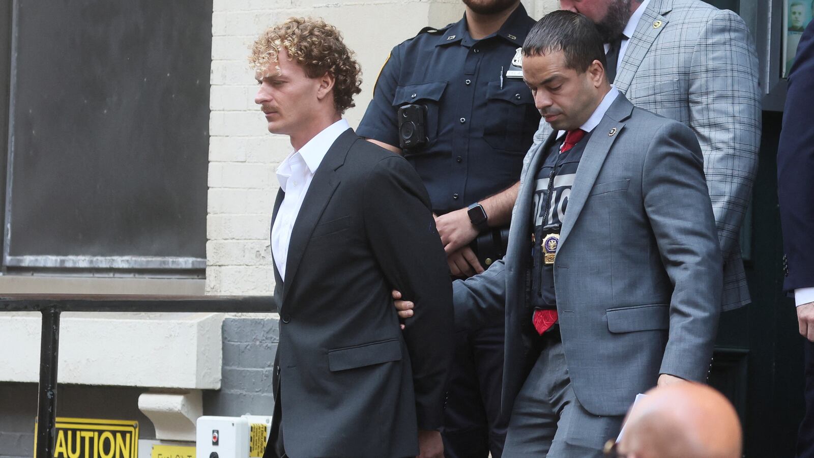 Former U.S. Marine Daniel Penny is taken from a New York City Police precinct under arrest for the death of Jordan Neely.