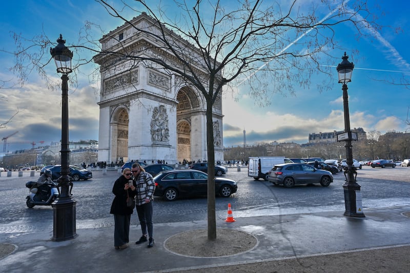 View of the Arc de Triomphe, with the Eiffel Tower in the distance, illustration of tourism and daily life in the capital, Paris, France, on January 17, 2026. (Photo by Henrique Campos / Hans Lucas / AFP via Getty Images)