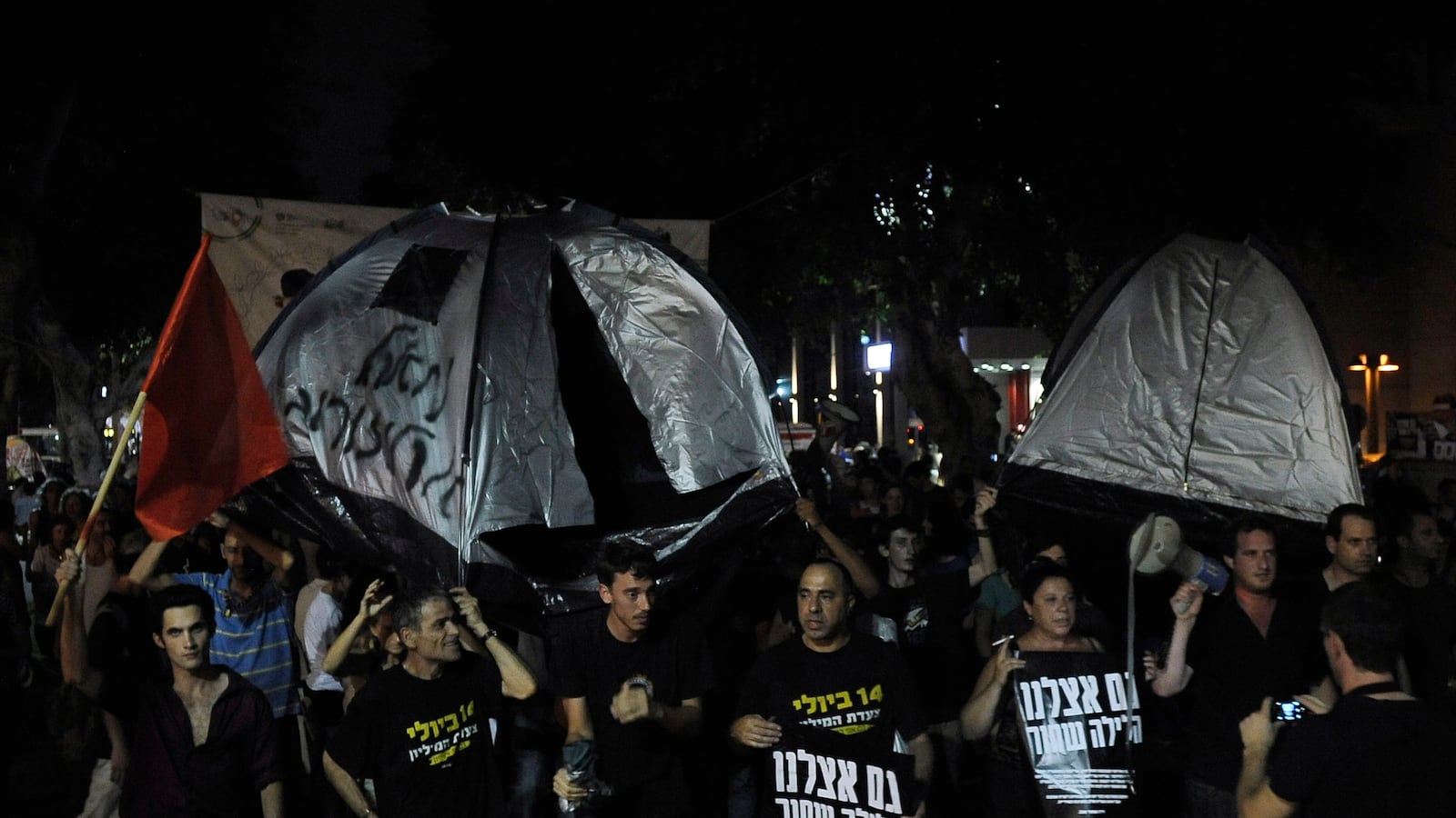 articles/2012/06/29/old-familiar-tunes-of-suppression/Tel-Aviv-Protest_tlexoy