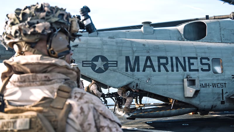U.S. Marines with Lima Company, Battalion Landing Team 3/5, 11th Marine Expeditionary Unit, board a CH-53E Super Stallion with Marine Medium Tiltrotor Squadron (VMM) 163 (Reinforced), 11th MEU, before an amphibious assault in the Pacific Ocean, March 2, 2026.