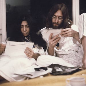 Yoko Ono and John Lennon sit up in bed at the Hilton hotel in Amsterdam, Netherlands in March 1969.