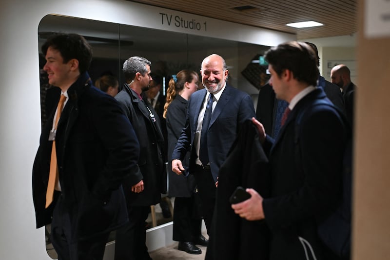 US' Commerce secretary Howard Lutnick walk in a hallway on the sidelines of the World Economic Forum (WEF) annual meeting in Davos on January 20, 2026. The World Economic Forum takes place in Davos from January 19 to January 23, 2026. (Photo by Fabrice COFFRINI / AFP via Getty Images)