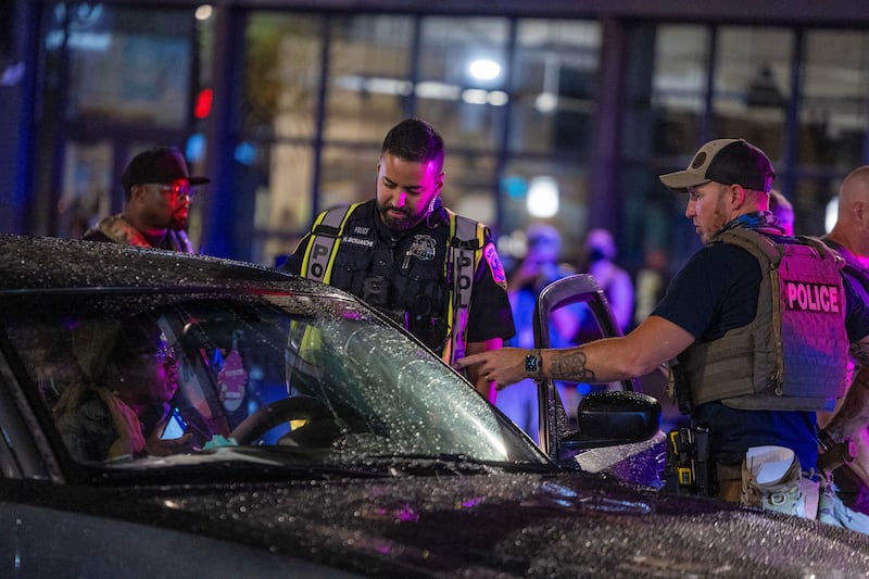 WASHINGTON, DC - AUGUST 13: Washington DC Metro Police officers question a driver at a roadside checkpoint on 14th street Northwest on August 13, 2025 in Washington, DC. U.S. President Donald Trump announced plans to deploy federal officers and the National Guard to the District in order to place the DC Metropolitan Police Department under federal control and assist in crime prevention in the nation's capital.  (Photo by Tasos Katopodis/Getty Images)