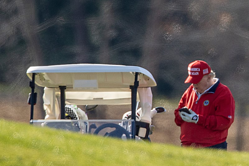 STERLING, VIRGINIA - NOVEMBER 26: US President Donald Trump makes a phone call as he golfs at Trump National Golf Club on November 26, 2020 in Sterling, Virginia. President Trump stayed in Washington, DC this year for Thanksgiving due the Covid-19 outbreak in the United States. (Photo by Tasos Katopodis/Getty Images)