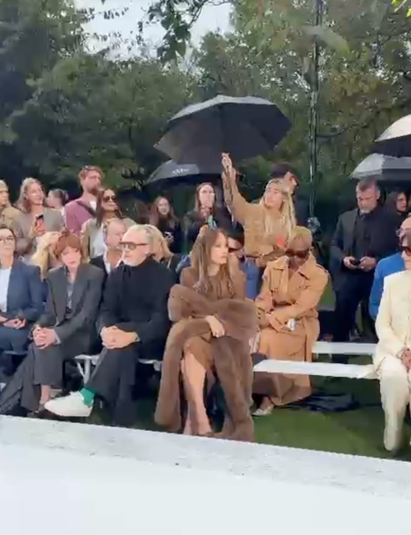 The moment a staffer takes away the umbrella.