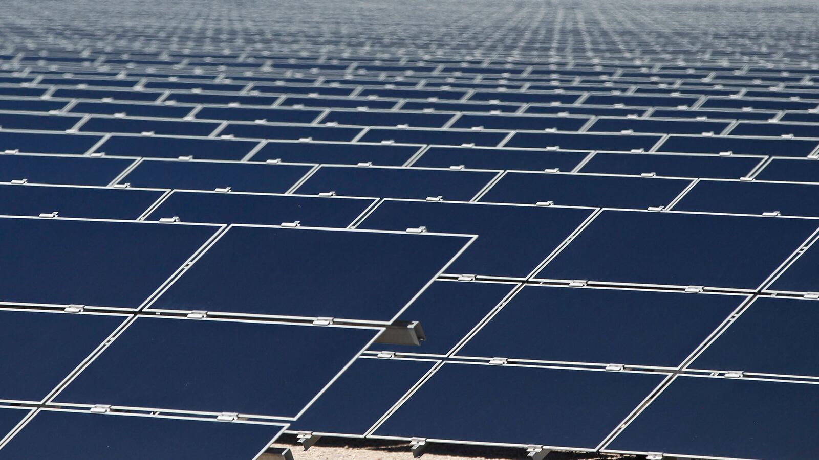 articles/2014/04/24/solar-power-burns-old-utilities-business-models/140423-solar-panels-tease_gj3co2