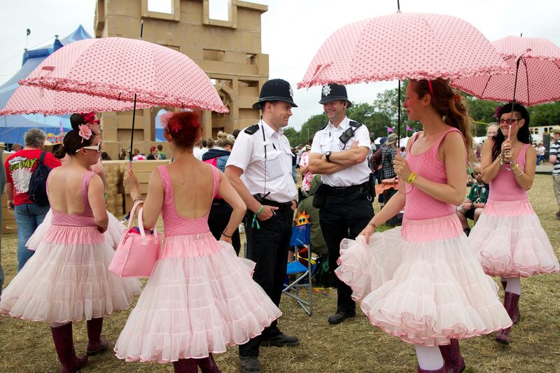 galleries/2013/07/01/mick-jagger-kate-moss-more-stars-at-glastonbury-2013-photos/130630-glastonbury-pink-ballerinas-policemen_fbthz5