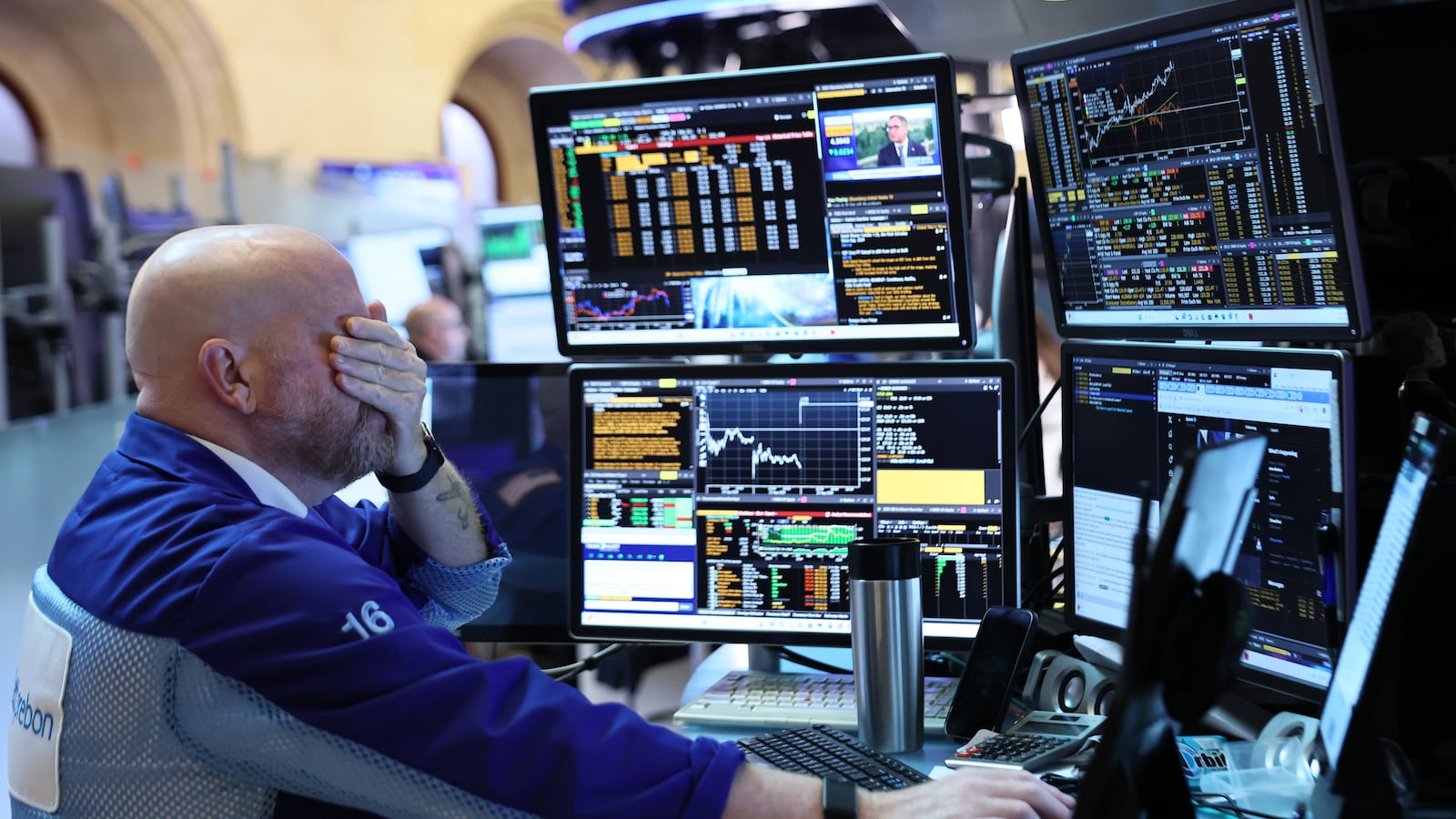 Traders work on the floor of the New York Stock Exchange during morning trading on August 22, 2025 in New York City.