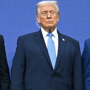 US President Donald Trump (C) hosts the signing ceremony of a peace deal with the President of Rwanda Paul Kagame (L) and the President of the Democratic Republic of the Congo Felix Tshisekedi (R) at the United States Institute of Peace in Washington, DC, on December 4, 2025. Trump on Thursday brings the leaders of Rwanda and the Democratic Republic of Congo together to endorse a deal that Trump has hailed as his latest peace triumph despite ongoing violence on the ground. Trump hopes the agreement will pave the way for the United States to gain access to critical minerals in the eastern DRC, a violence-torn region home to many of the key ingredients in modern technologies such as electric cars.