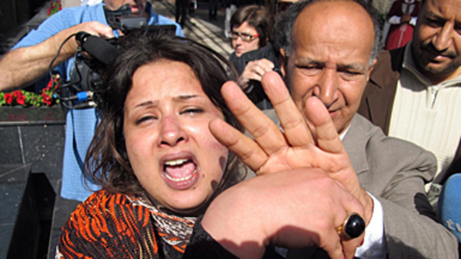 articles/2011/03/30/emad-al-obeidi-sued-for-being-raped-in-libya/griswold-eman-rape_170170_tgzwby