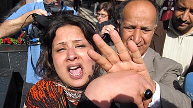 articles/2011/03/30/emad-al-obeidi-sued-for-being-raped-in-libya/griswold-eman-rape_170170_tgzwby