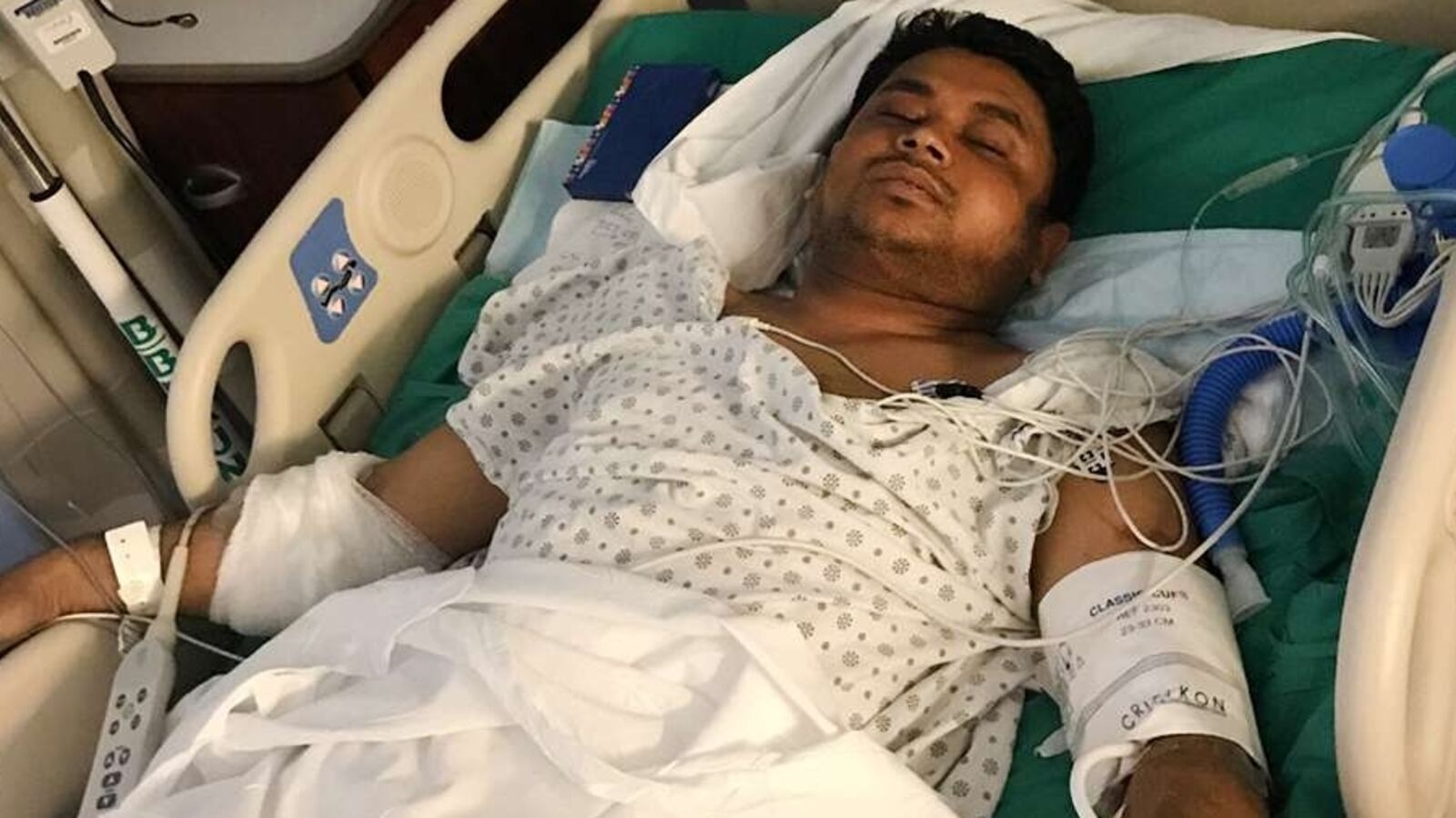 Maruf Hossain in a hospital bed