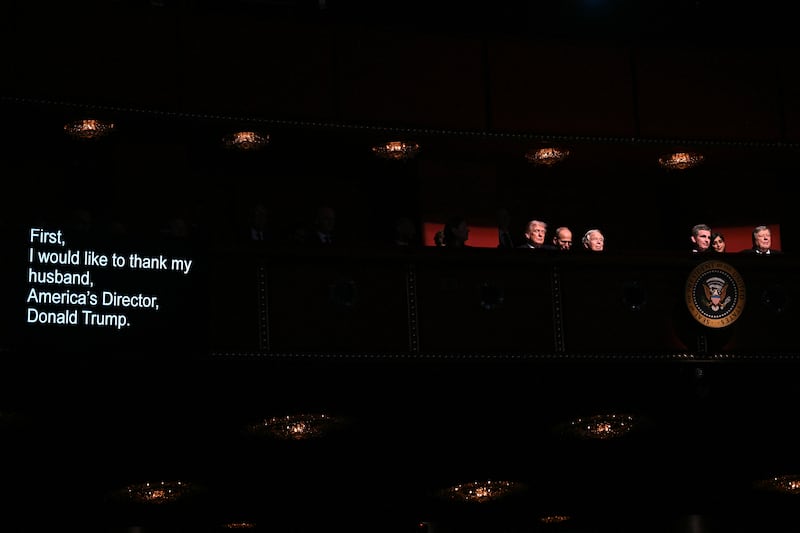 The teleprompter shows the words being read by U.S. First Lady Melania Trump (out of frame) as US President Donald Trump (L) and guests attend the world premiere of Amazon MGM Studios' "Melania" at the Kennedy Center in Washington, DC, on January 29, 2026.