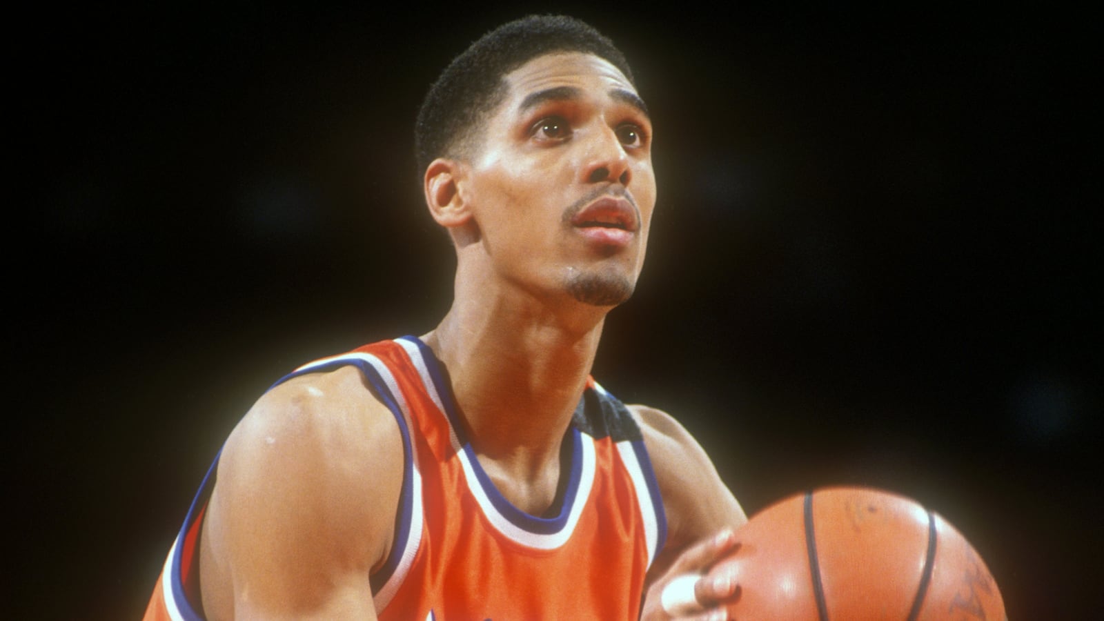 Lawrence Moten playing basketball.